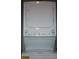 Modern white stacked washer and dryer with accessible control panels and energy guide at 2090 Cross Gate Blvd # 301, Myrtle Beach, SC 29575