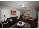 Inviting living room showcasing hardwood floors, stylish decor, and a seamless flow into the dining area at 2090 Cross Gate Blvd # 301, Myrtle Beach, SC 29575