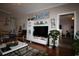 Inviting living room with hardwood floors, large entertainment center and view into other rooms at 2090 Cross Gate Blvd # 301, Myrtle Beach, SC 29575