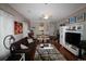 Bright living room featuring stylish furnishings, hardwood floors, and abundant natural light at 2090 Cross Gate Blvd # 301, Myrtle Beach, SC 29575