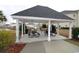 Picnic area with tables and a grill under a shaded shelter at 2090 Cross Gate Blvd # 301, Myrtle Beach, SC 29575