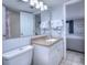 Bright bathroom showcasing a vanity with a solid-surface countertop and a well-lit mirror at 210 75Th Ave N # 4042, Myrtle Beach, SC 29572