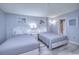 Relaxing bedroom showcasing two beds with white headboards, serene artwork, and soft lighting at 210 75Th Ave N # 4042, Myrtle Beach, SC 29572