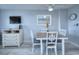 Cozy dining area with seating for four, complemented by a nearby dresser and a flat-screen TV at 210 75Th Ave N # 4042, Myrtle Beach, SC 29572