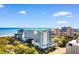 Stunning aerial view of the beachfront condo complex with beautiful ocean views and blue skies at 215 77Th Ave. N # 702, Myrtle Beach, SC 29572