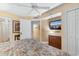 Bright bedroom with a TV, closet, and connecting bathroom at 215 77Th Ave. N # 702, Myrtle Beach, SC 29572