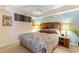 Comfortable bedroom with floral bedding and warm lighting at 215 77Th Ave. N # 702, Myrtle Beach, SC 29572