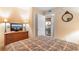 Comfortable bedroom with view of the kitchen and decorative lamps at 215 77Th Ave. N # 702, Myrtle Beach, SC 29572