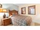 Charming bedroom with decorative lamps and framed pictures at 215 77Th Ave. N # 702, Myrtle Beach, SC 29572