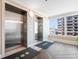 Clean elevator lobby with metal elevators, patterned floors and a bright window view at 215 77Th Ave. N # 702, Myrtle Beach, SC 29572