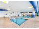 Inviting indoor pool area with a hot tub, clear water, and tile accents at 215 77Th Ave. N # 702, Myrtle Beach, SC 29572