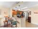 Open-concept kitchen with stainless appliances, granite countertops, and barstool seating area, with tile floor at 215 77Th Ave. N # 702, Myrtle Beach, SC 29572