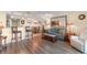 Inviting living space with wood floors, a kitchen view, and stylish furnishings at 215 77Th Ave. N # 702, Myrtle Beach, SC 29572