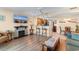 Open-concept living room with a kitchen, fireplace, and bar seating at 215 77Th Ave. N # 702, Myrtle Beach, SC 29572