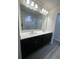 Well-lit bathroom featuring dual sinks, modern fixtures, and a bright shower, providing a comfortable space at 2247 Union Church Rd., Little River, SC 29566