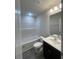 Well-lit bathroom featuring a tub-shower combo and modern vanity with light fixtures at 2247 Union Church Rd., Little River, SC 29566