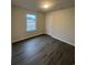 A cozy bedroom with modern vinyl flooring, a window with a view and a bright, comfortable atmosphere at 2247 Union Church Rd., Little River, SC 29566