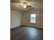 Bedroom featuring vaulted ceiling, ceiling fan, luxury vinyl plank flooring and a bright window at 2247 Union Church Rd., Little River, SC 29566