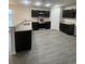 Well-lit modern kitchen featuring stainless steel appliances, granite countertops, and sleek cabinetry at 2247 Union Church Rd., Little River, SC 29566