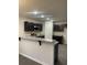 Modern kitchen with granite countertops, stainless steel appliances, a breakfast bar and black cabinetry at 2247 Union Church Rd., Little River, SC 29566