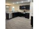 Modern kitchen features stainless appliances, granite counters, and ample cabinet space at 2247 Union Church Rd., Little River, SC 29566