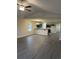 Bright, open-concept living area with luxury vinyl plank flooring and ceiling fan at 2247 Union Church Rd., Little River, SC 29566