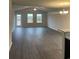 Open concept living space with vaulted ceiling and vinyl plank flooring at 2247 Union Church Rd., Little River, SC 29566