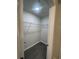 Empty walk-in closet, featuring modern vinyl plank flooring and ample storage space with wire shelving at 2247 Union Church Rd., Little River, SC 29566