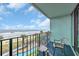 Relax on the balcony with ocean views overlooking the pool and palm trees at 2311 S Ocean Blvd. # 430, Myrtle Beach, SC 29577