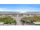 Pathway leading down to the sandy beach and ocean with blue skies overhead at 2311 S Ocean Blvd. # 430, Myrtle Beach, SC 29577