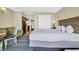 Comfortable bedroom features a king bed, soft lighting, and convenient access to the adjacent kitchenette at 2311 S Ocean Blvd. # 430, Myrtle Beach, SC 29577