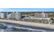 Aerial view showcasing a beautiful beach and condo community with oceanfront access at 2311 S Ocean Blvd. # 430, Myrtle Beach, SC 29577