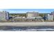 Aerial view featuring a beach and resort property with pools, sun umbrellas, and ocean views at 2311 S Ocean Blvd. # 430, Myrtle Beach, SC 29577