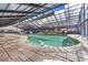 Bright indoor pool area featuring brick-lined pool and large retractable glass atrium at 2311 S Ocean Blvd. # 430, Myrtle Beach, SC 29577