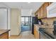 View of a kitchenette and a bedroom through the doorway at 2311 S Ocean Blvd. # 430, Myrtle Beach, SC 29577