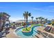 Scenic lazy river winds through lush tropical landscaping, steps away from the beautiful beach at 2311 S Ocean Blvd. # 430, Myrtle Beach, SC 29577