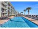 Large swimming pool with lounge chairs next to the ocean at 2311 S Ocean Blvd. # 430, Myrtle Beach, SC 29577