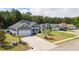 A neighborhood view of well-maintained homes with lush green lawns and mature trees surrounding the properties at 247 Dempsey Dr., Loris, SC 29569