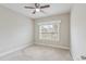Bedroom with neutral carpet, ceiling fan and window at 247 Dempsey Dr., Loris, SC 29569