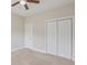 Bedroom with neutral carpet, fan and closet at 247 Dempsey Dr., Loris, SC 29569