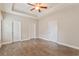 A serene bedroom featuring multiple closets and wood flooring, offering ample space and style at 247 Dempsey Dr., Loris, SC 29569