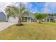Beautiful home showcasing well-maintained landscaping and a cozy front porch, perfect for enjoying the outdoors at 247 Dempsey Dr., Loris, SC 29569