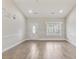 A cozy living room enhanced by an inspirational anchor decal, a door and window at 247 Dempsey Dr., Loris, SC 29569