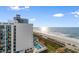 Aerial view showcases the building's pool, beach access, and oceanfront location at 2501 S Ocean Blvd. # 831, Myrtle Beach, SC 29577
