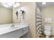 Functional bathroom with a vanity, mirror, and a shower-tub combination with a gray and white striped curtain at 2501 S Ocean Blvd. # 831, Myrtle Beach, SC 29577