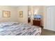 Well-lit bedroom offering two beds, a dresser with a TV, and tasteful decor for a comfortable stay at 2501 S Ocean Blvd. # 831, Myrtle Beach, SC 29577