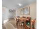 Dining area features a wooden table with seating for six, tile floors, and neutral walls at 2501 S Ocean Blvd. # 831, Myrtle Beach, SC 29577