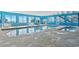 Indoor pool area with bright blue walls, large windows, and access to an outdoor area at 2501 S Ocean Blvd. # 831, Myrtle Beach, SC 29577