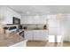 Bright kitchen with white cabinets, modern appliances, and granite countertops at 2501 S Ocean Blvd. # 831, Myrtle Beach, SC 29577