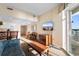 Comfortable living space with a dining area, TV, and balcony access, complemented by the open-concept kitchen at 2501 S Ocean Blvd. # 831, Myrtle Beach, SC 29577